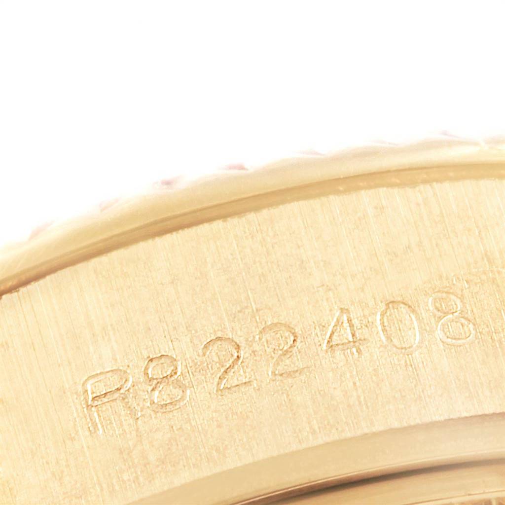 This close-up image shows the side of the Rolex President 69178 Women
s Yellow Gold Champagne Dial 69178 Women
s Yellow Gold Champagne Dial model watch with visible serial numbers etched on its case.