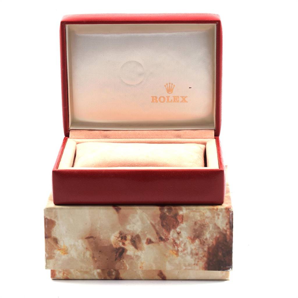 This image shows an open box for a Rolex President 69178 Women
s Yellow Gold Champagne Dial 69178 Women
s Yellow Gold Champagne Dial model watch, with the inner cushion and the Rolex logo visible.