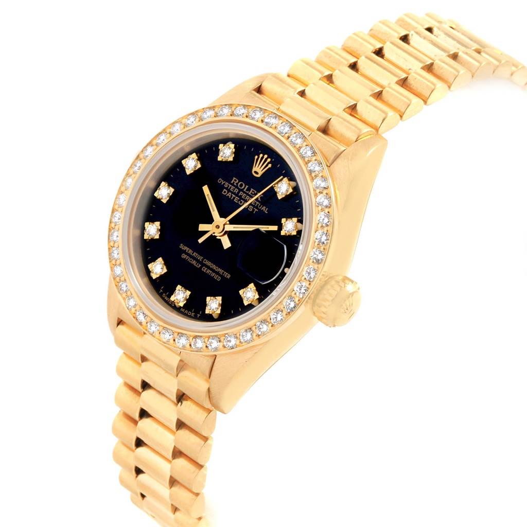 This image shows a close-up of a Rolex President 69138 Women
s Yellow Gold Black Dial 69138 Women
s Yellow Gold Black Dial watch, highlighting its bracelet, bezel, crown, and dial.