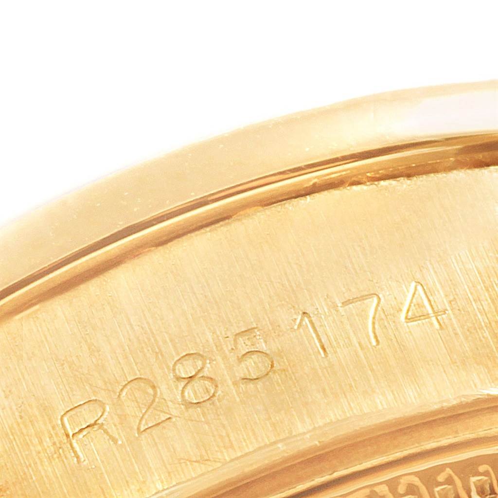 This close-up image shows the serial number engraving on the case back of a Rolex President 69138 Women
s Yellow Gold Black Dial 69138 Women
s Yellow Gold Black Dial model watch.