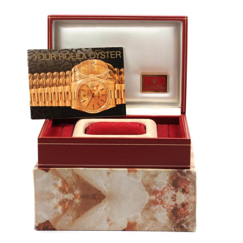 The image displays a Rolex President 79088 Women
s Yellow Gold Champagne Dial 79088 Women
s Yellow Gold Champagne Dial model watch box with its manual, presented at a straight-on angle.