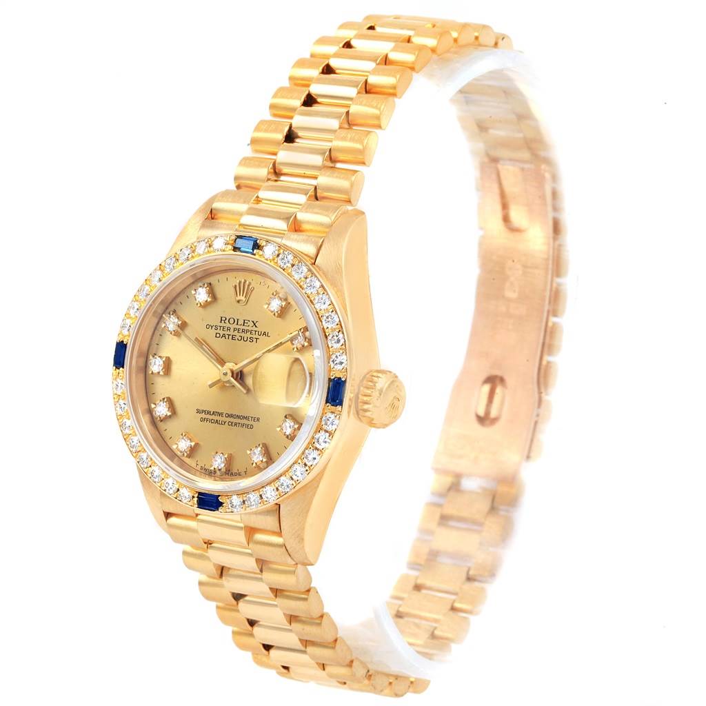 This image shows a Rolex President 79088 Women
s Yellow Gold Champagne Dial 79088 Women
s Yellow Gold Champagne Dial model watch from an angled side view, displaying its gold bracelet, diamond bezel, and face.