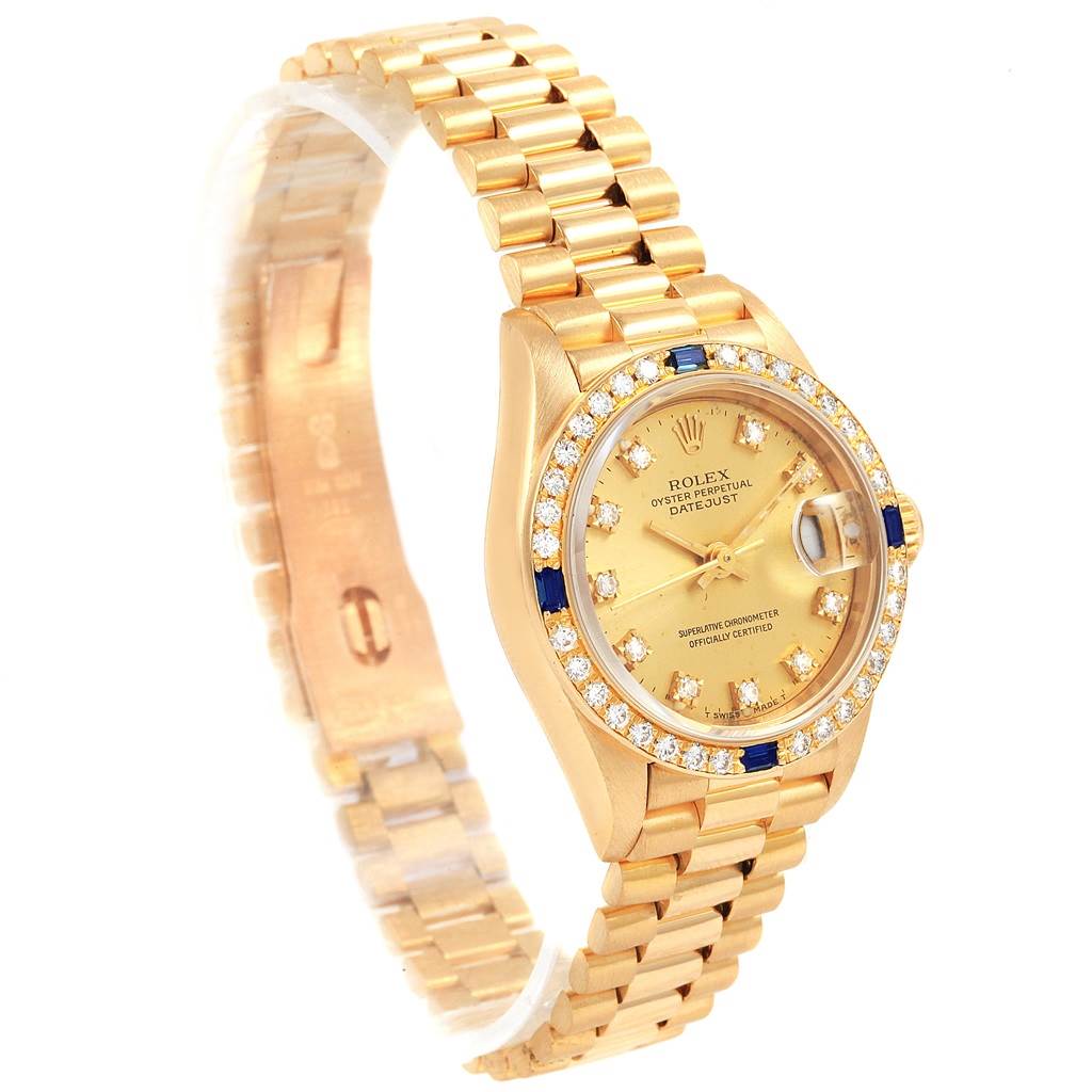 This image shows a Rolex President 79088 Women
s Yellow Gold Champagne Dial 79088 Women
s Yellow Gold Champagne Dial model watch angled to display the gold case, bezel, dial, and bracelet.