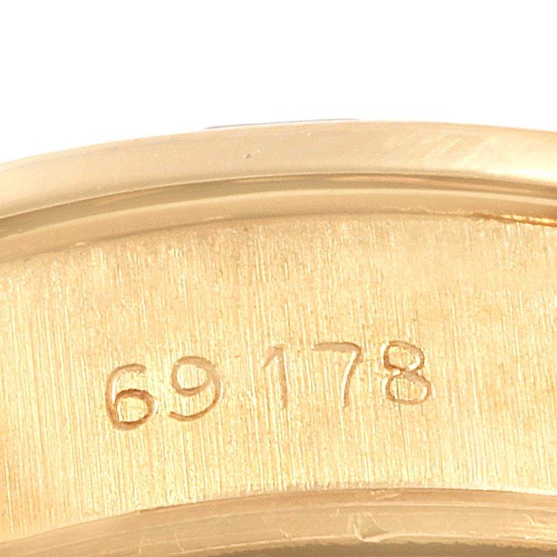 This image shows a close-up of the serial number "69178" engraved on the gold case of the Rolex President 79088 Women
s Yellow Gold Champagne Dial 79088 Women
s Yellow Gold Champagne Dial watch.