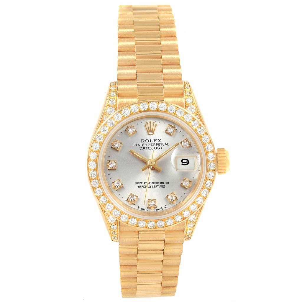 The image shows a top view of the Rolex President 69238 Women's Yellow Gold Silver Dial 69238 Women's Yellow Gold Silver Dial model watch, highlighting its gold band, diamond-encrusted bezel, and date display.