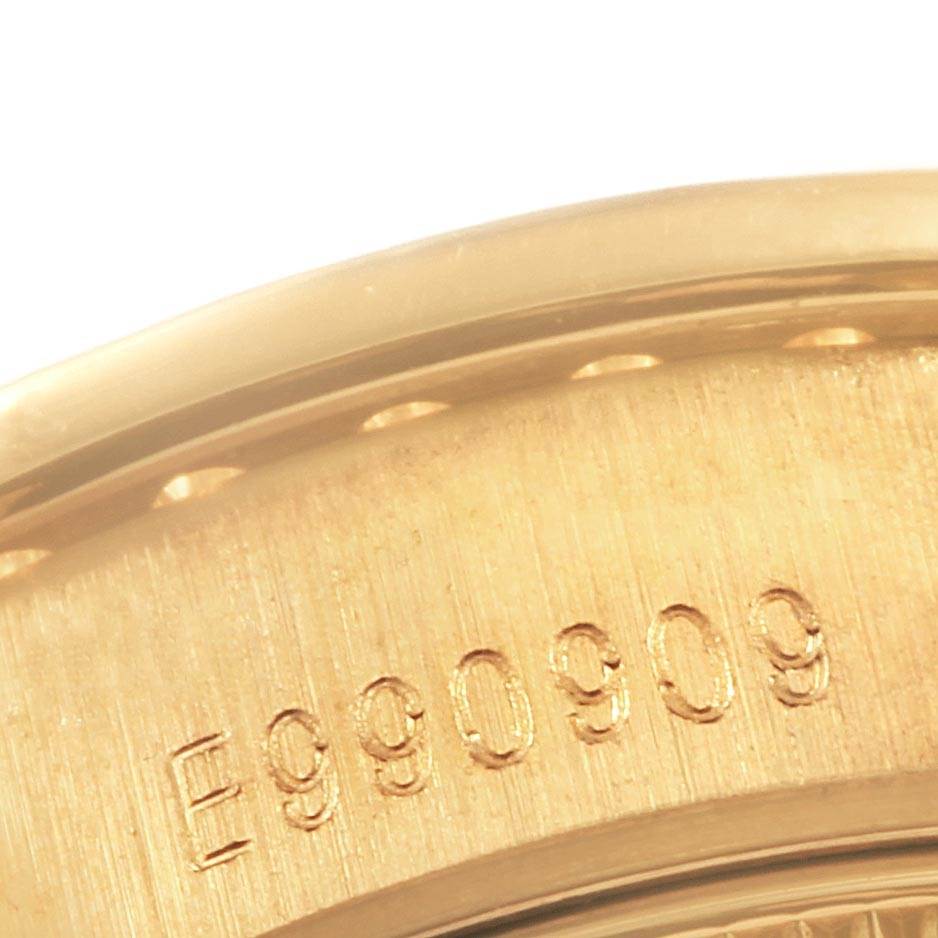 This close-up image shows the serial number engraving on the side of a Rolex President 69238 Women's Yellow Gold Silver Dial 69238 Women's Yellow Gold Silver Dial watch.