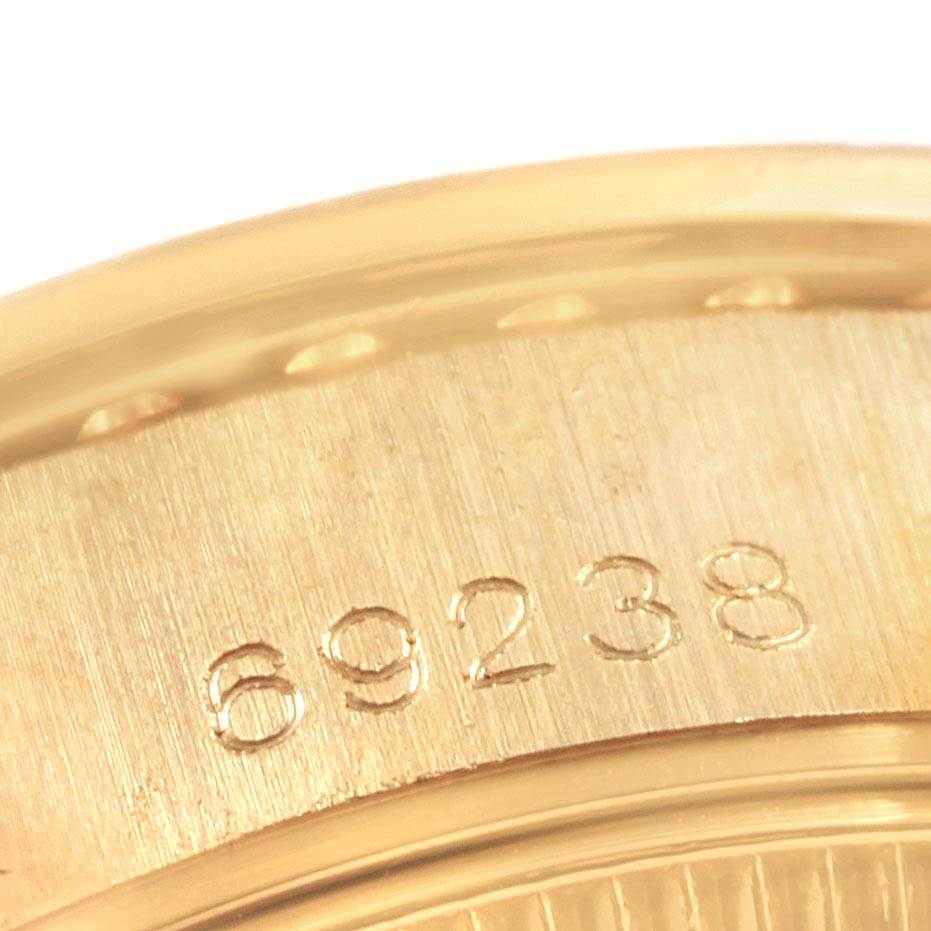 This close-up image shows the side of a Rolex President 69238 Women's Yellow Gold Silver Dial 69238 Women's Yellow Gold Silver Dial model with the reference number 69238.