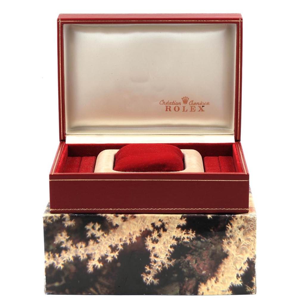 This image shows the open box packaging of the Rolex President 69238 Women's Yellow Gold Silver Dial 69238 Women's Yellow Gold Silver Dial model watch, highlighting its interior lining and cushion.