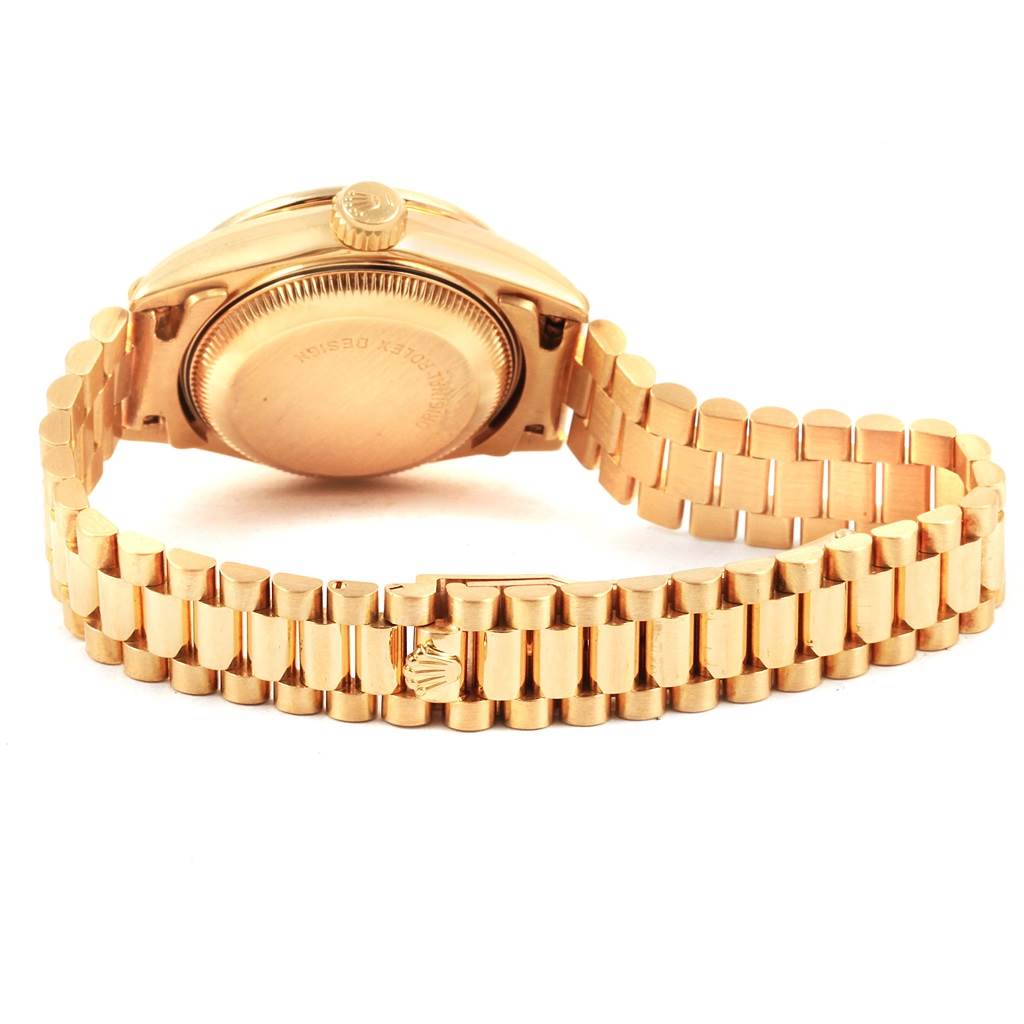 This image shows the back and bracelet of a Rolex President 69238 Women's Yellow Gold Silver Dial 69238 Women's Yellow Gold Silver Dial model watch.