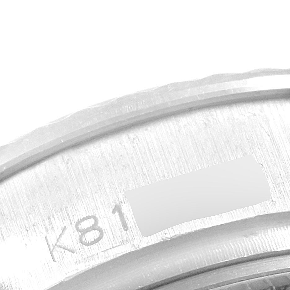 This close-up image shows the engraved serial number on the case back of a Rolex President 179179 Women's White Gold Silver Dial 179179 Women's White Gold Silver Dial model watch.