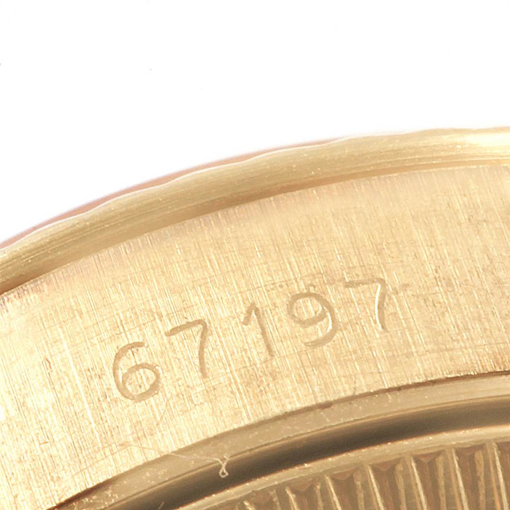 Close-up of the serial number engraving on the Rolex President 67197 Women's Yellow Gold Silver Dial 67197 Women's Yellow Gold Silver Dial model watch case.