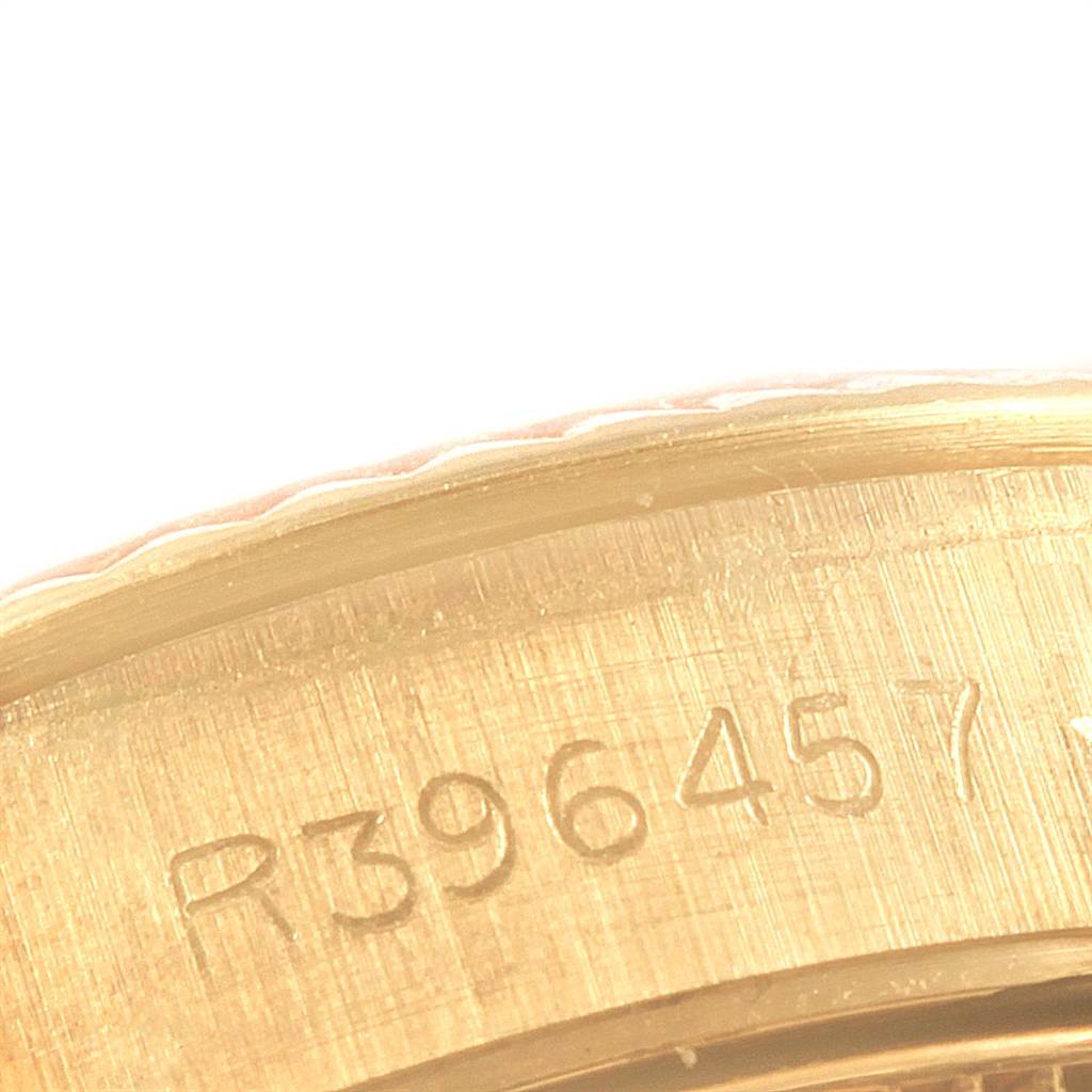 The image shows a close-up of the serial number engravings inside the case of a Rolex President 67197 Women's Yellow Gold Silver Dial 67197 Women's Yellow Gold Silver Dial model watch.