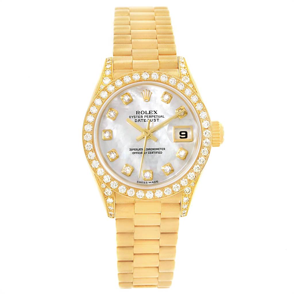 This image shows a Rolex President 69158 Women
s Yellow Gold Mother of Pearl Dial 69158 Women
s Yellow Gold Mother of Pearl Dial model watch from a top view, featuring a gold band, gemstone-encrusted bezel, and date display.