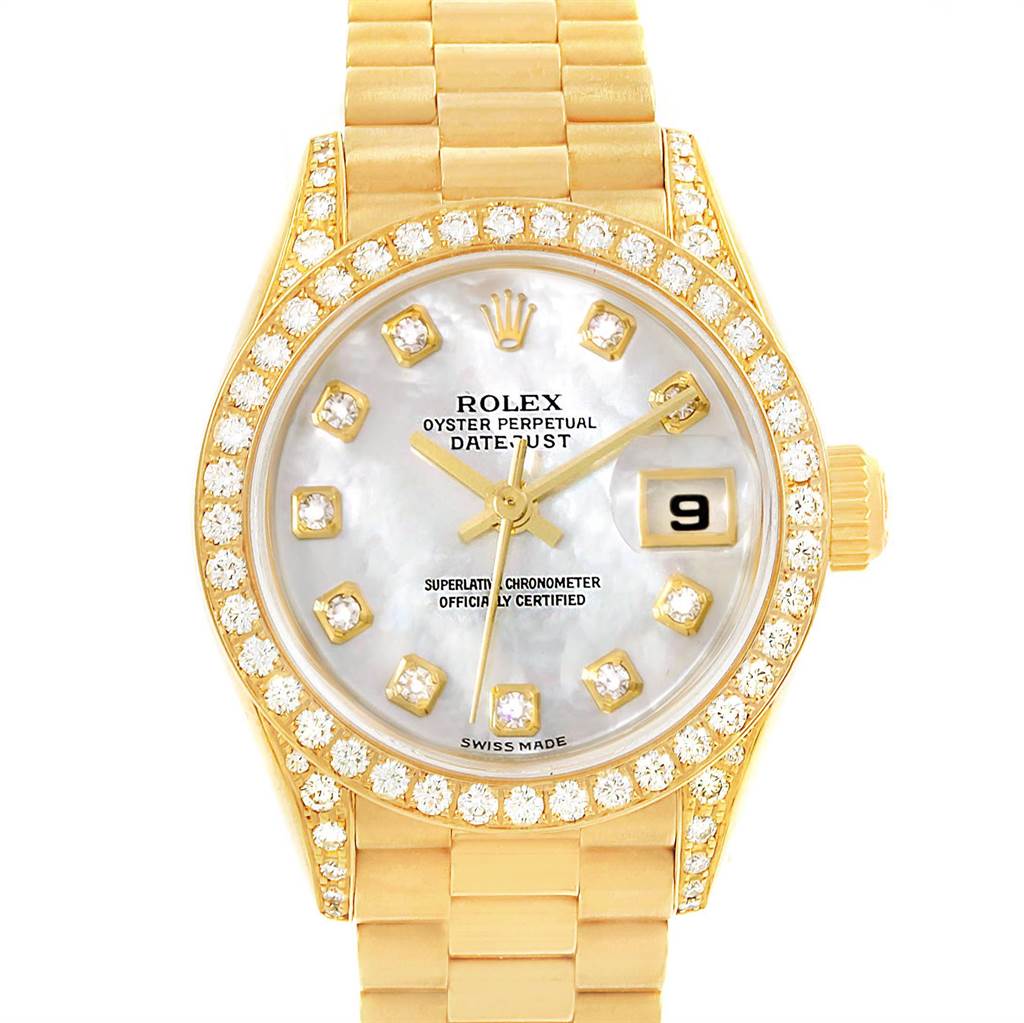 This image shows a front view of a Rolex President 69158 Women
s Yellow Gold Mother of Pearl Dial 69158 Women
s Yellow Gold Mother of Pearl Dial model watch, featuring a gold bracelet, a diamond-studded bezel, and a date display.