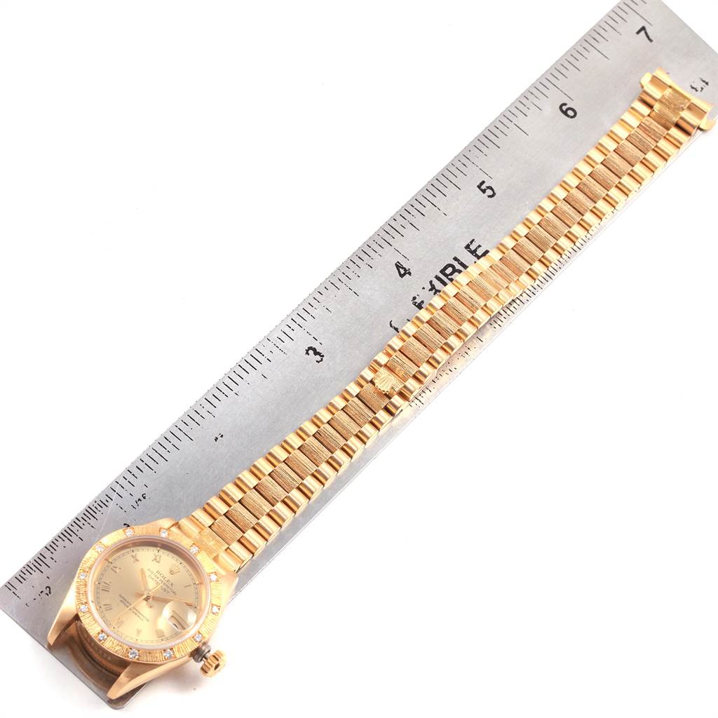The Rolex President 69288 Women
s Yellow Gold Champagne Dial 69288 Women
s Yellow Gold Champagne Dial model watch is shown from a top-down angle with both the face and full gold bracelet visible.