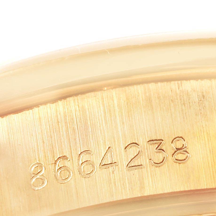 This image shows a close-up of the serial number engraved on the casing of a Rolex President 69288 Women
s Yellow Gold Champagne Dial 69288 Women
s Yellow Gold Champagne Dial model watch.