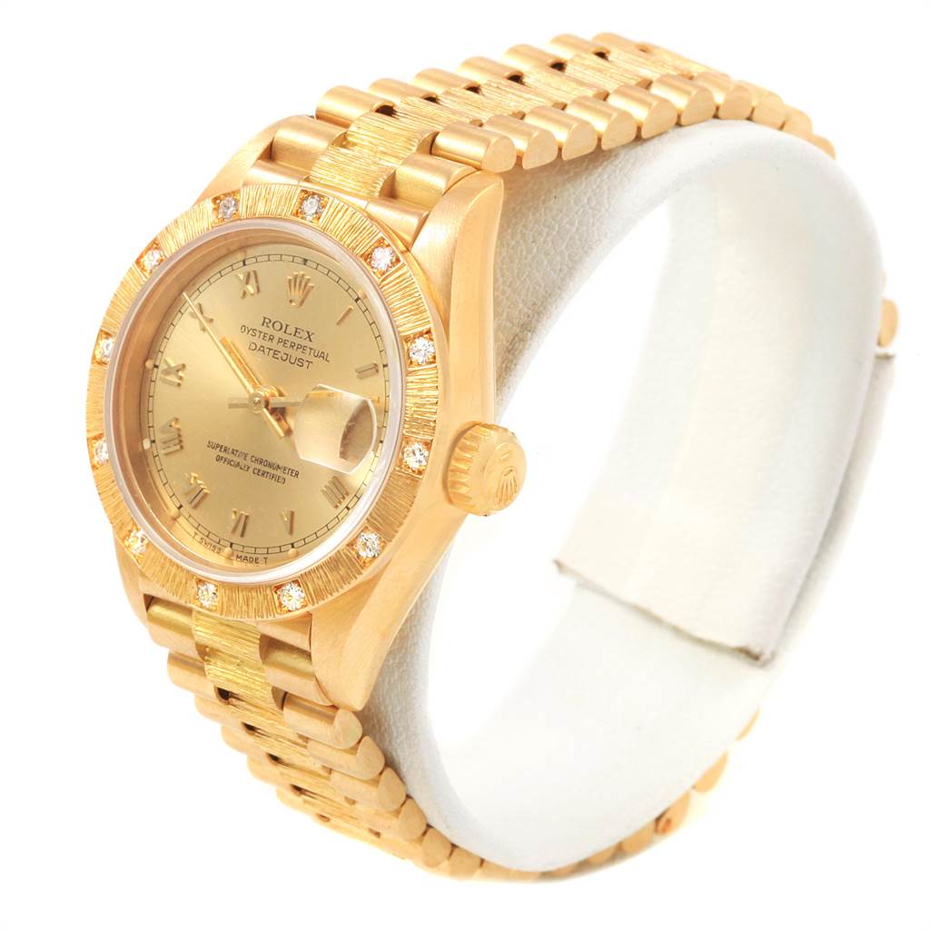The image shows a side angle of a Rolex President 69288 Women
s Yellow Gold Champagne Dial 69288 Women
s Yellow Gold Champagne Dial model, displaying the dial, bezel, crown, and bracelet.