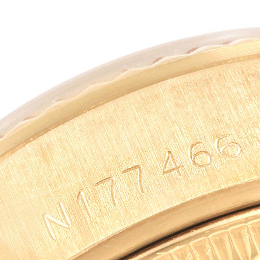 This close-up image shows the engraved serial number on the side of the case for a Rolex President 69178 Women
s Yellow Gold Champagne Dial 69178 Women
s Yellow Gold Champagne Dial model watch.