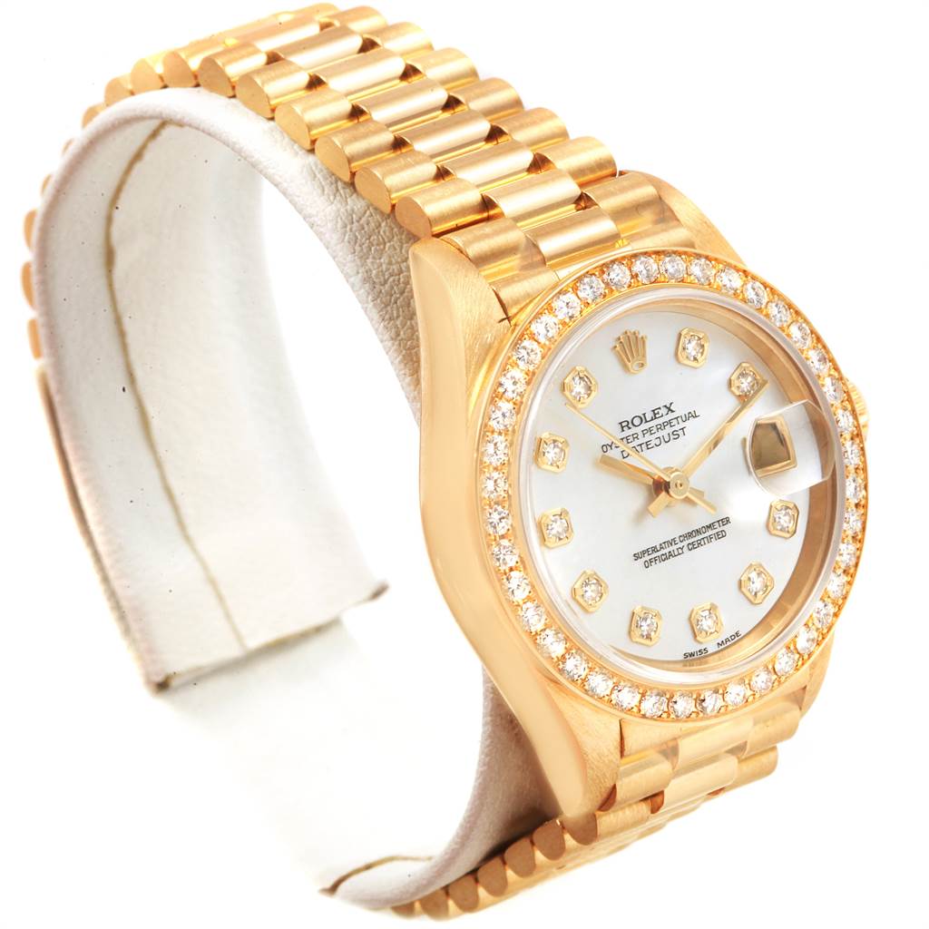 This image shows a Rolex President 69138 Women
s Yellow Gold Mother of Pearl Dial 69138 Women
s Yellow Gold Mother of Pearl Dial model watch at a slight angle, highlighting the dial, bezel, and part of the bracelet.