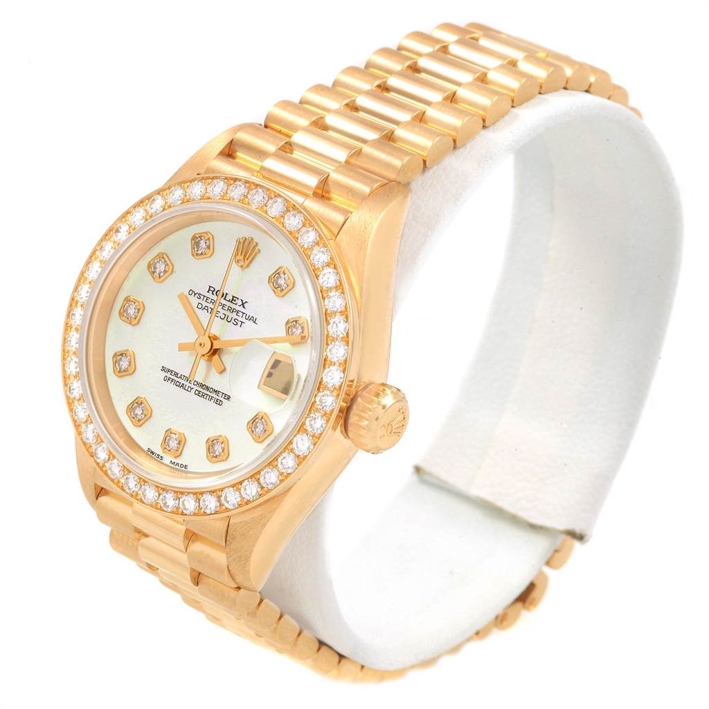 The Rolex President 69138 Women
s Yellow Gold Mother of Pearl Dial 69138 Women
s Yellow Gold Mother of Pearl Dial model watch is shown at a slight angle, displaying the face, bezel, crown, and bracelet.