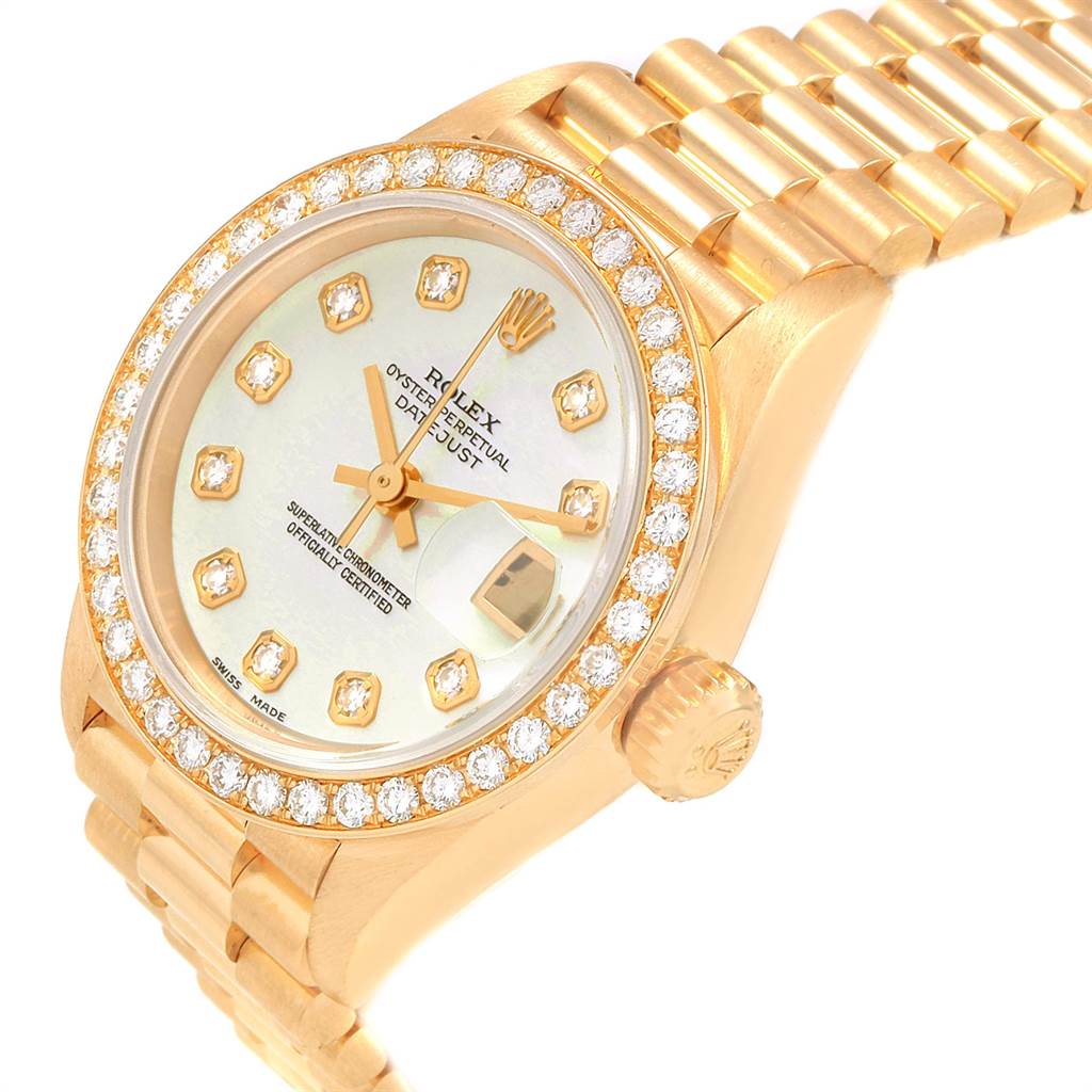 The Rolex President 69138 Women
s Yellow Gold Mother of Pearl Dial 69138 Women
s Yellow Gold Mother of Pearl Dial model watch is shown from an angled perspective, highlighting the dial, bezel, crown, and part of the bracelet.