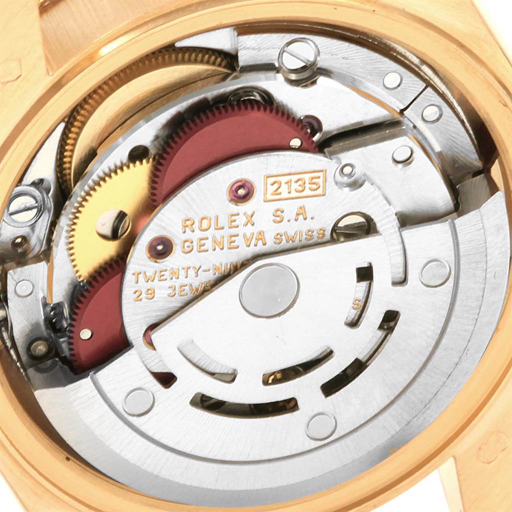 The image shows an internal view of the Rolex President 69138 Women
s Yellow Gold Mother of Pearl Dial 69138 Women
s Yellow Gold Mother of Pearl Dial model watch, highlighting its mechanical movement components.