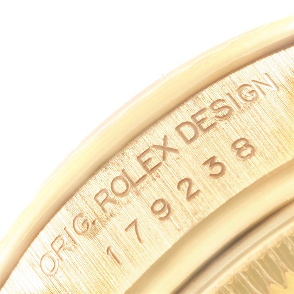The image shows a close-up angle of the serialized bezel edge of the President model by Rolex.