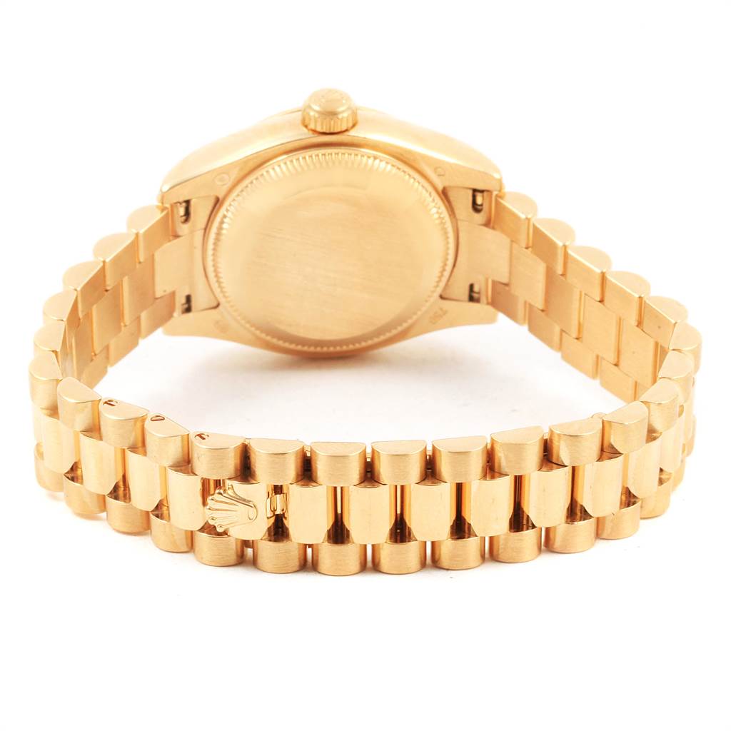 This image showcases the back and bracelet of a Rolex President 179238 Women
s Yellow Gold Mother of Pearl Dial 179238 Women
s Yellow Gold Mother of Pearl Dial model watch from a rear angle.