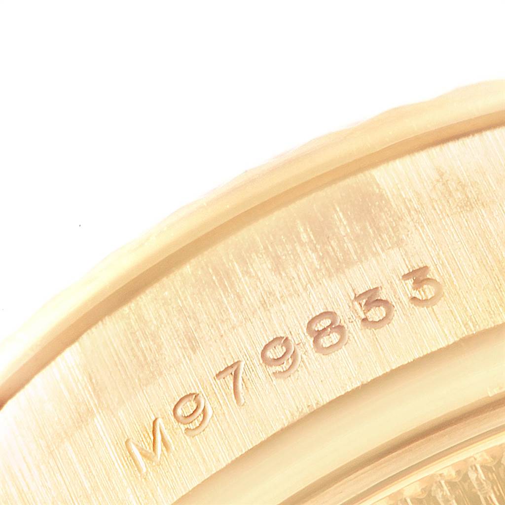 The image shows a close-up of the serial number engraving on the outer bezel of a Rolex President 179238 Women
s Yellow Gold Mother of Pearl Dial 179238 Women
s Yellow Gold Mother of Pearl Dial model watch.
