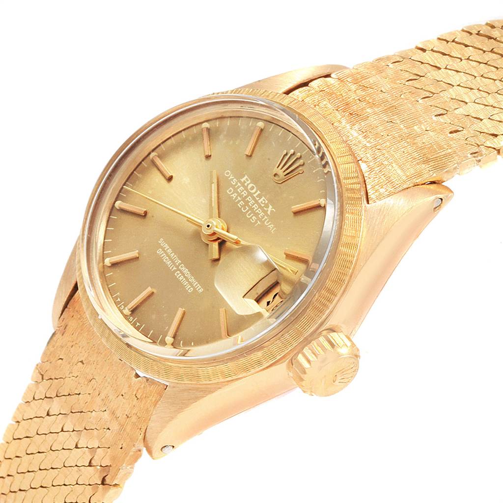 The Rolex President 6703 Women's Yellow Gold Champagne Dial 6703 Women's Yellow Gold Champagne Dial model watch is shown from an angled view, displaying the dial, crown, and part of the gold bracelet.
