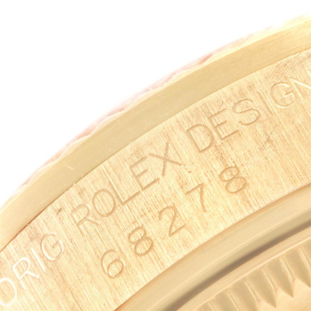 This close-up image shows the edge of the caseback with engraved text of the Rolex President 68278 Women
s Yellow Gold Champagne Dial 68278 Women
s Yellow Gold Champagne Dial watch model.
