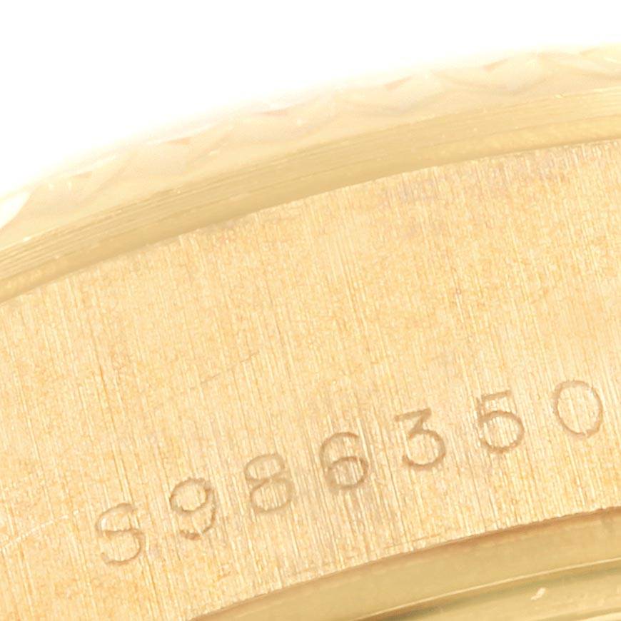 This image shows a close-up angle of the gold casing and serial number engraving on a Rolex President 69178 Women
s Yellow Gold White Dial 69178 Women
s Yellow Gold White Dial model watch.