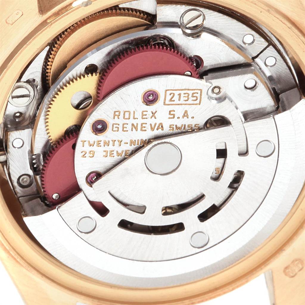 This image shows a close-up of the movement mechanism of a Rolex President 69178 Women
s Yellow Gold White Dial 69178 Women
s Yellow Gold White Dial model watch, highlighting its intricate components.