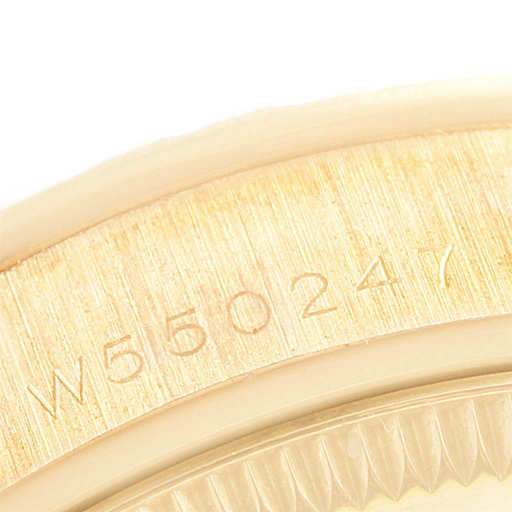 The image shows a close-up of the serial number on the case back of a Rolex President 68258 Women
s Yellow Gold Champagne Dial 68258 Women
s Yellow Gold Champagne Dial model watch.
