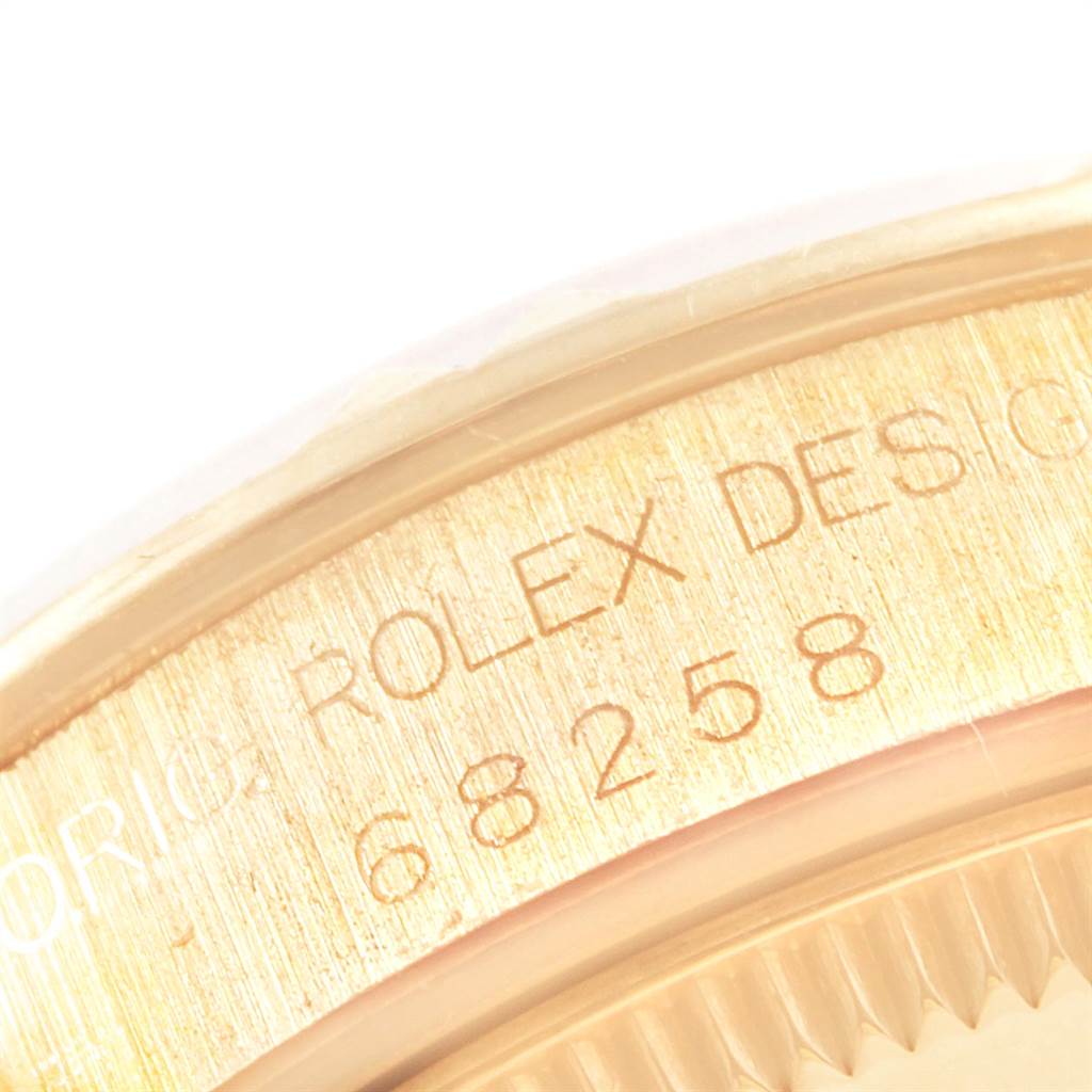 This image shows a close-up of the case back and model number of a Rolex President 68258 Women
s Yellow Gold Champagne Dial 68258 Women
s Yellow Gold Champagne Dial watch, model 68258.