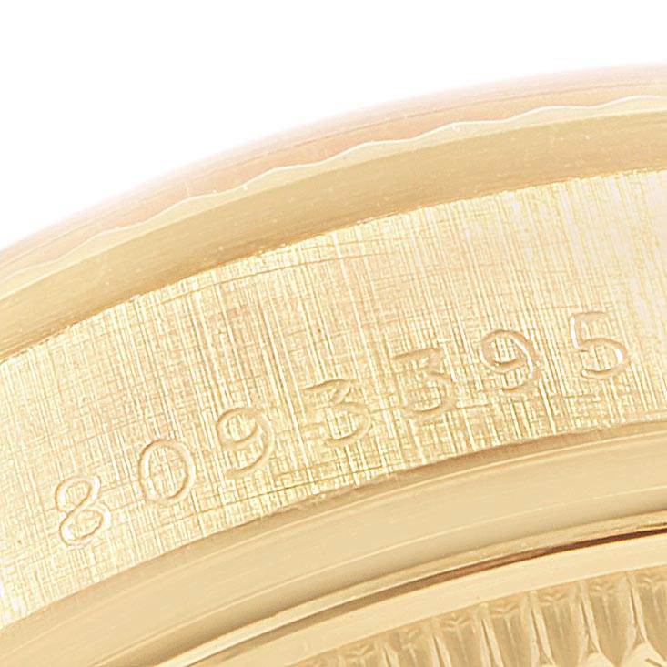 Close-up of the case side with serial number of a Rolex President 6827 Women
s Yellow Gold Champagne Dial 6827 Women
s Yellow Gold Champagne Dial model watch.