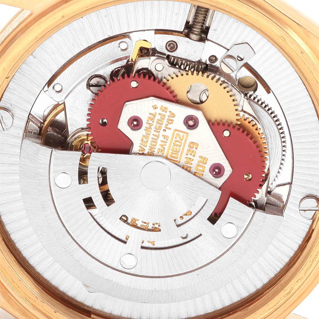 The image shows a close-up of the inner mechanical movement of a Rolex President 6827 Women
s Yellow Gold Champagne Dial 6827 Women
s Yellow Gold Champagne Dial model watch.