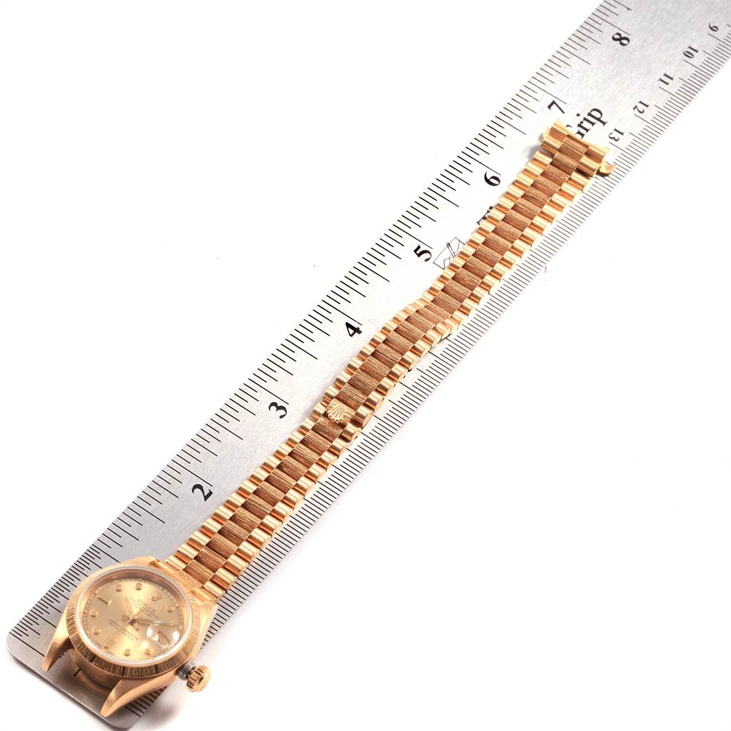 The image shows a gold Rolex President 69278 Women
s Yellow Gold Champagne Dial 69278 Women
s Yellow Gold Champagne Dial model watch, laid flat next to a ruler for measurement.