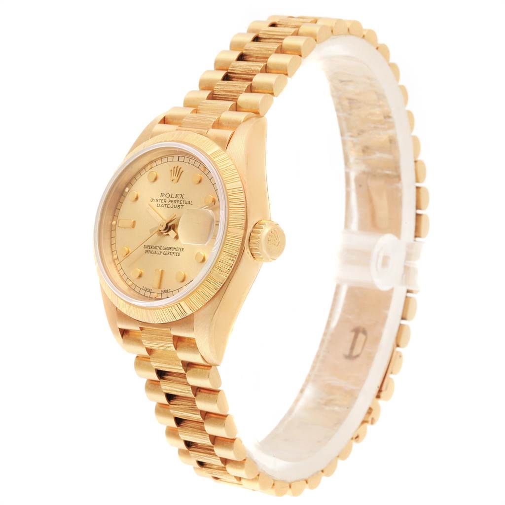 This image shows a side profile angle of a Rolex President 69278 Women
s Yellow Gold Champagne Dial 69278 Women
s Yellow Gold Champagne Dial model watch, displaying the face, crown, and bracelet in gold.