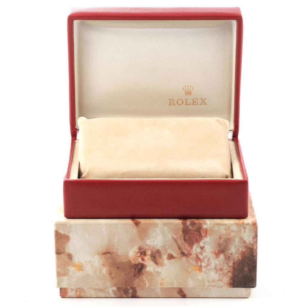 The image shows a Rolex President 67198 Women
s Yellow Gold Black Dial 67198 Women
s Yellow Gold Black Dial model watch box, open at a front angle with a cushion inside.