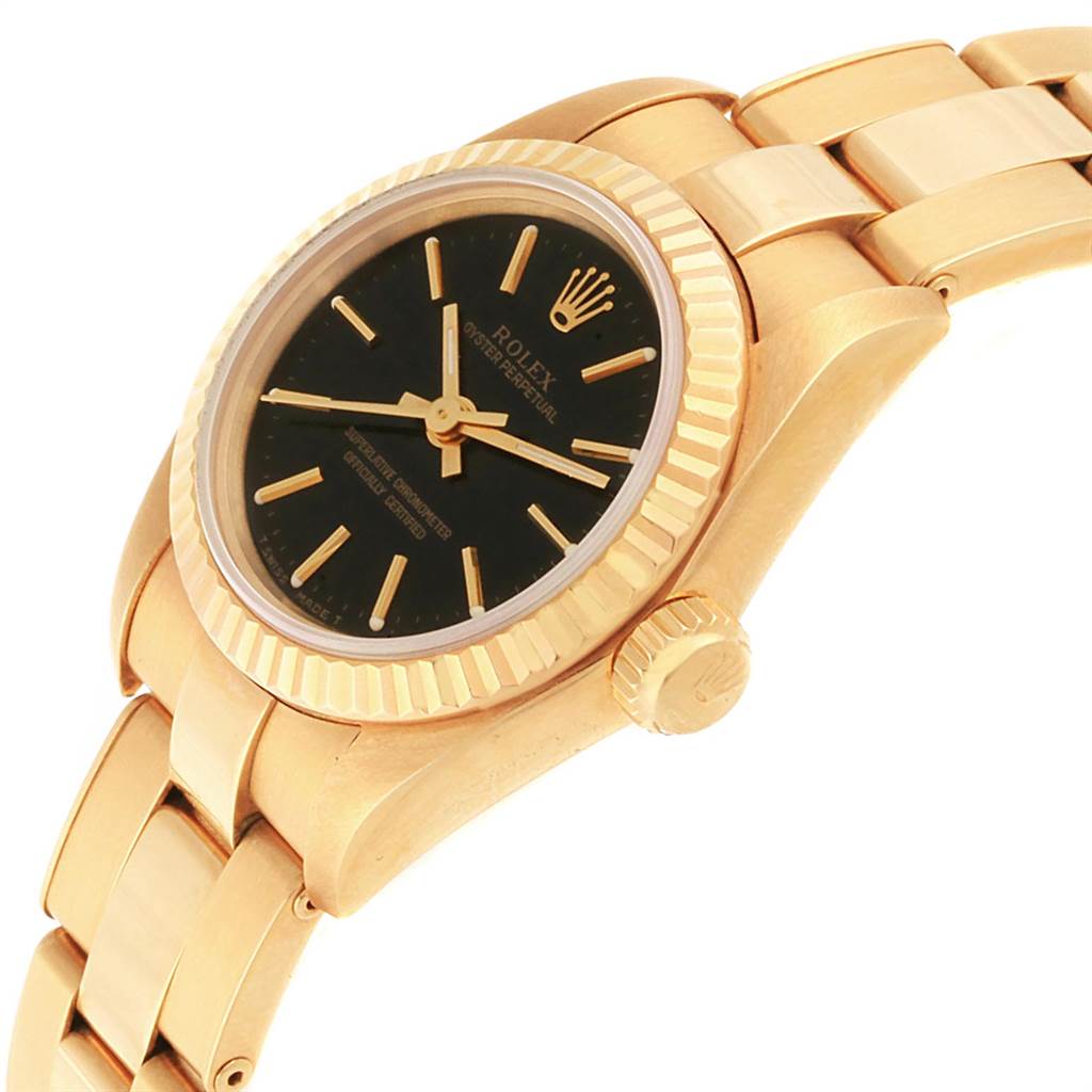 This image shows a gold Rolex President 67198 Women
s Yellow Gold Black Dial 67198 Women
s Yellow Gold Black Dial model watch at a slight angle, highlighting its case, crown, bezel, and part of the bracelet.