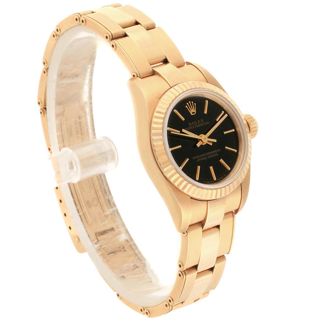 The Rolex President 67198 Women
s Yellow Gold Black Dial 67198 Women
s Yellow Gold Black Dial model watch is shown at a side angle, highlighting its gold bracelet, fluted bezel, and black dial.