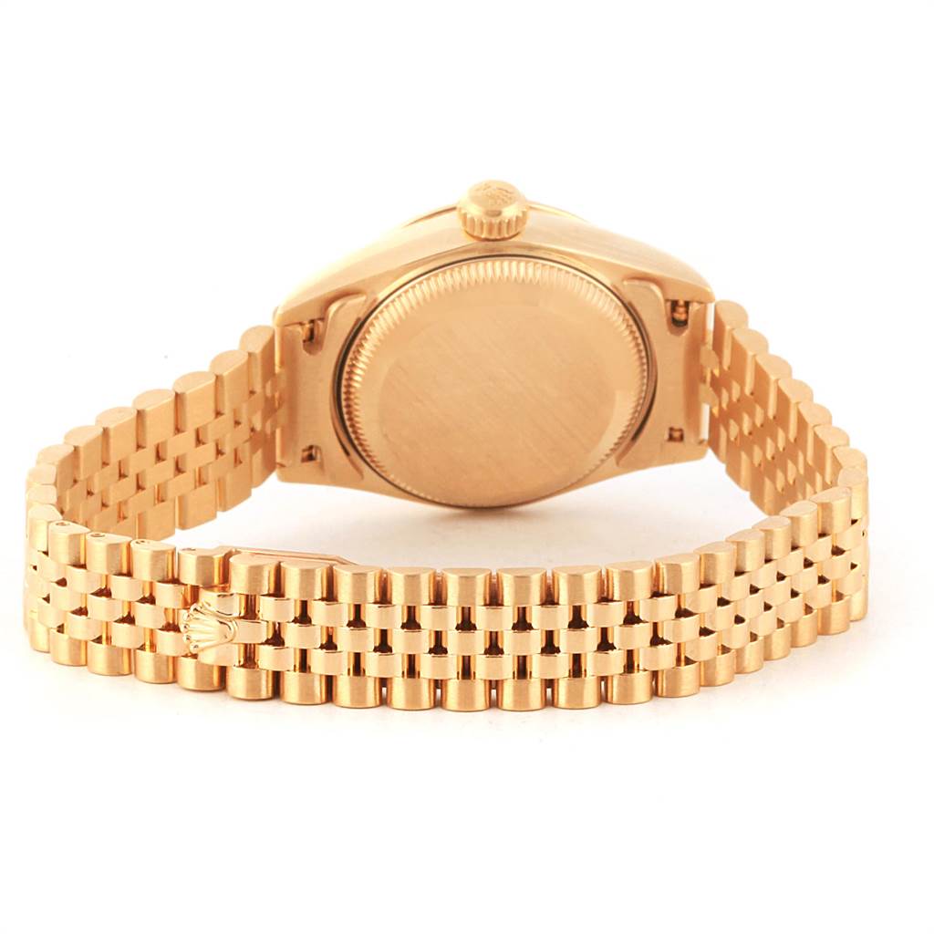 The image shows the back view of a Rolex President 79258 Women's Yellow Gold Beige Dial 79258 Women's Yellow Gold Beige Dial model watch, highlighting its case back and gold bracelet.