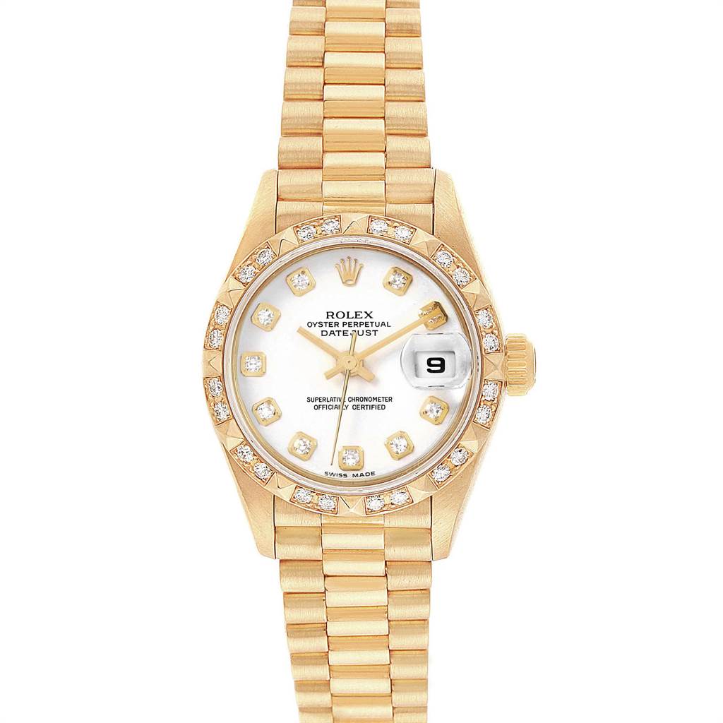 The image shows a Rolex President 69258 Women
s Yellow Gold White Dial 69258 Women
s Yellow Gold White Dial model watch, including the face, bezel, bracelet, and date display, from a top-down angle.