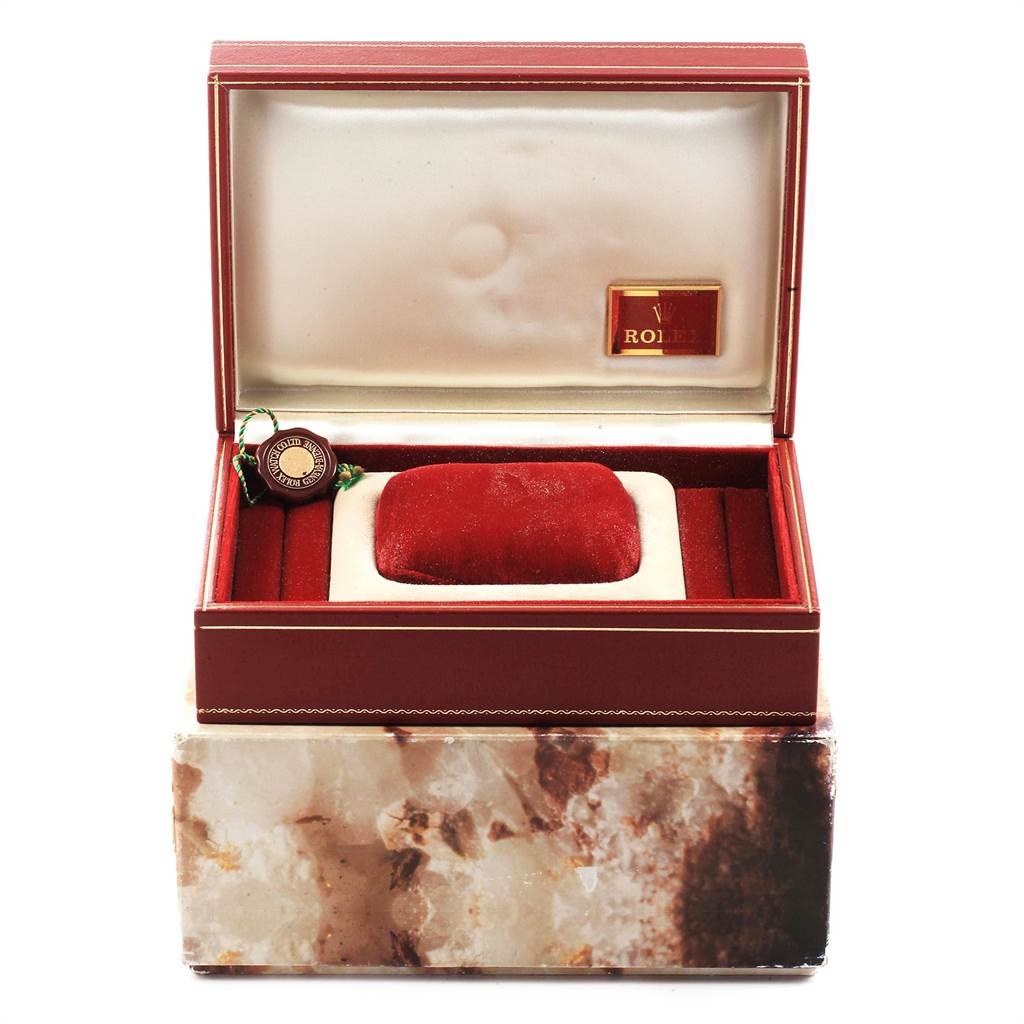 The image displays an open case for a Rolex President 69258 Women
s Yellow Gold White Dial 69258 Women
s Yellow Gold White Dial model watch, showing a red velvet cushion and a tag.