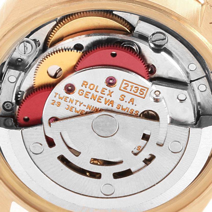 The image shows the intricate internal movement mechanism of a Rolex President 69258 Women
s Yellow Gold White Dial 69258 Women
s Yellow Gold White Dial model watch.