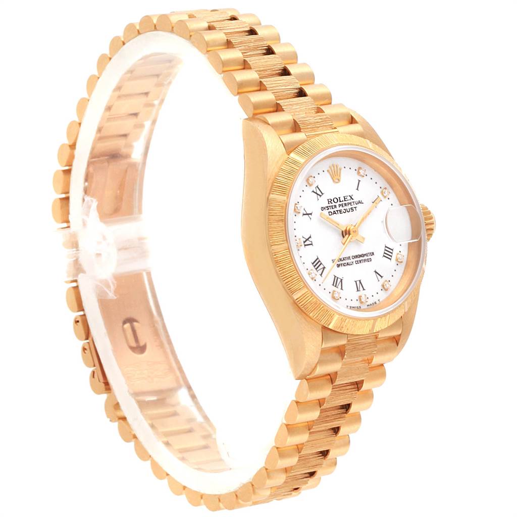 The image shows a side view of the Rolex President 69278 Women
s Yellow Gold White Dial 69278 Women
s Yellow Gold White Dial Datejust watch, featuring its gold bracelet and white Roman numeral dial.