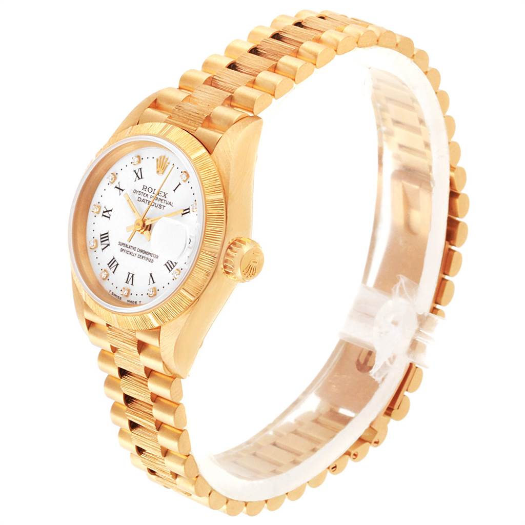The image shows a side view of a Rolex President 69278 Women
s Yellow Gold White Dial 69278 Women
s Yellow Gold White Dial model watch, highlighting the gold bracelet, crown, and face.