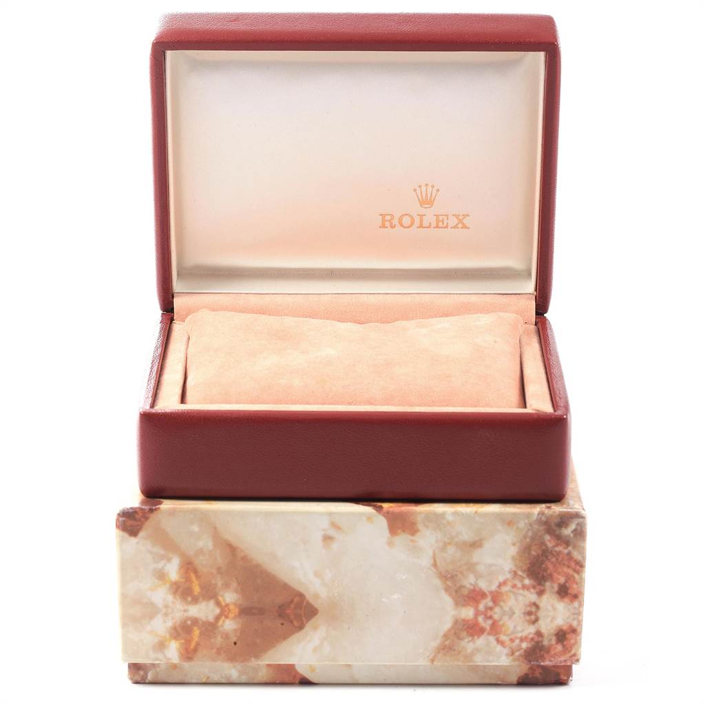 The image shows an open Rolex President 69278 Women
s Yellow Gold Champagne Dial 69278 Women
s Yellow Gold Champagne Dial model watch box, revealing a cushioned interior designed for holding the watch.