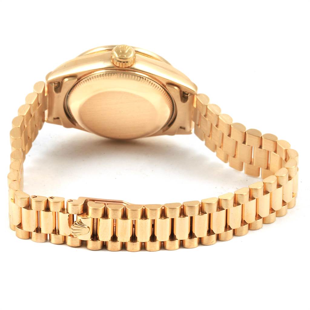 This image shows the back and side view of the Rolex President 69138 Women's Yellow Gold Champagne Dial 69138 Women's Yellow Gold Champagne Dial model watch, highlighting its gold case and bracelet.